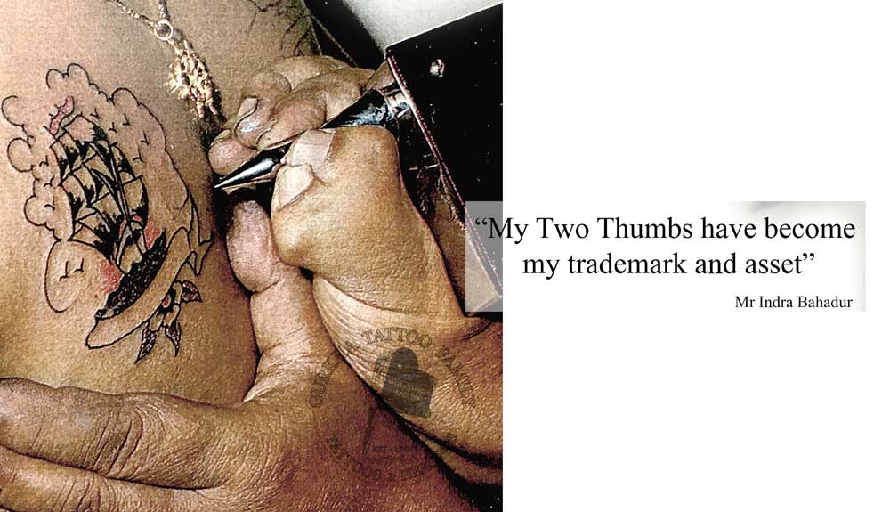 2 thumbs tattoo